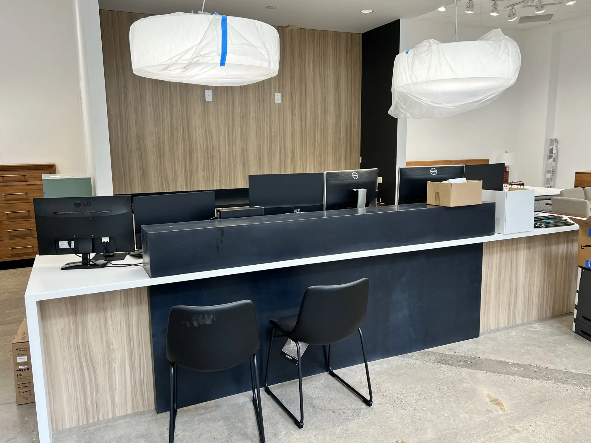 Sales desk with a waterfall top and wood-grain panels