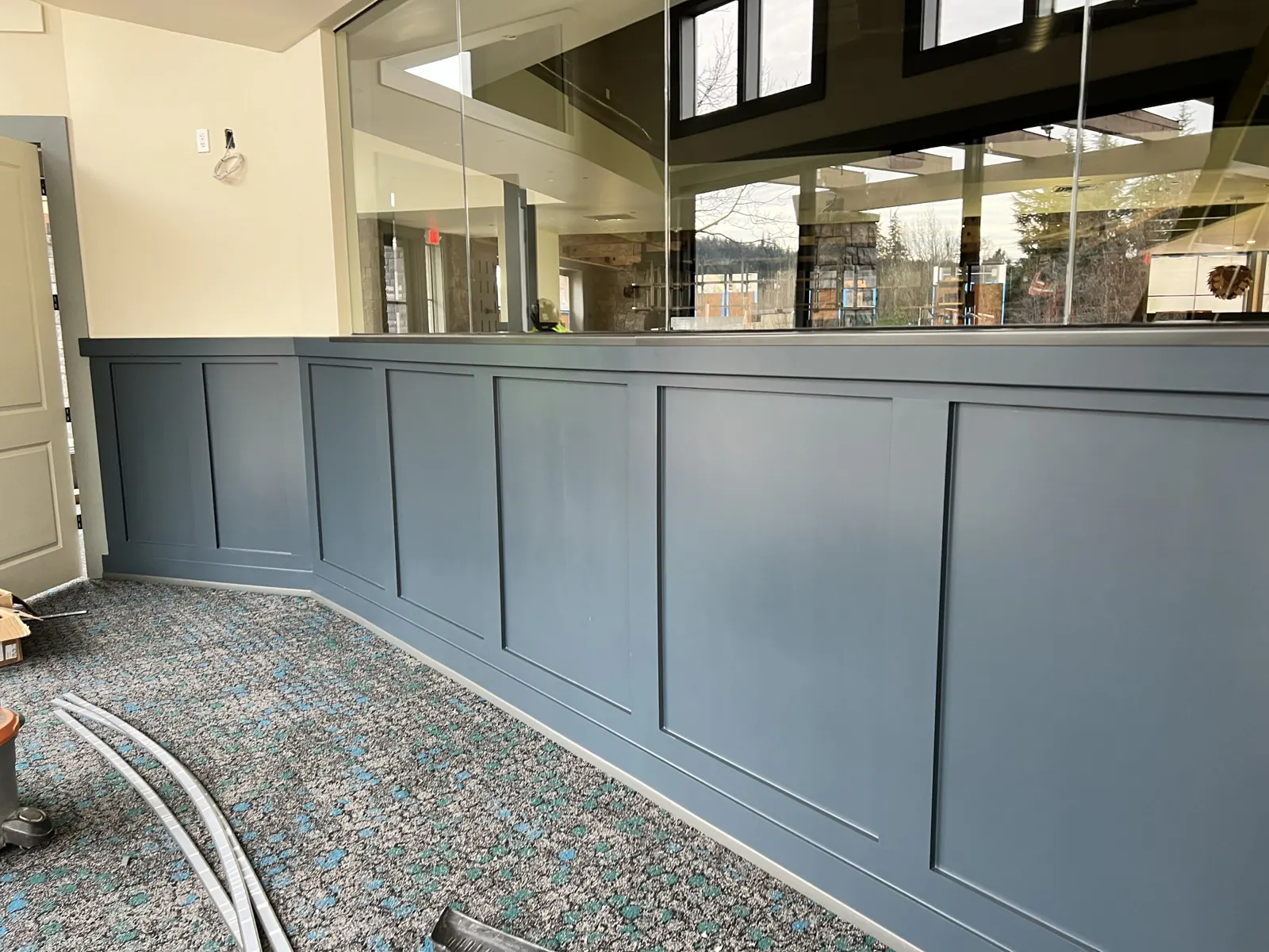 Painted panel wainscot along a dining area