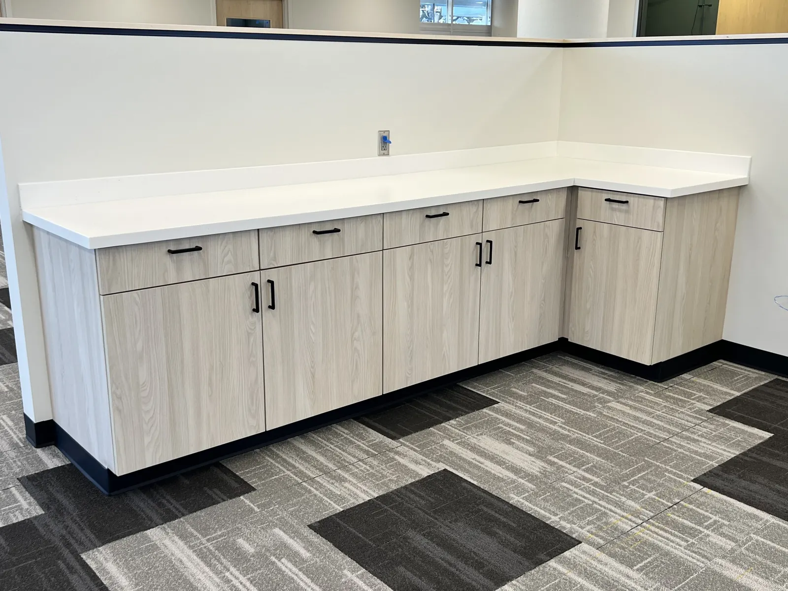 L-shaped cabinets with a white top