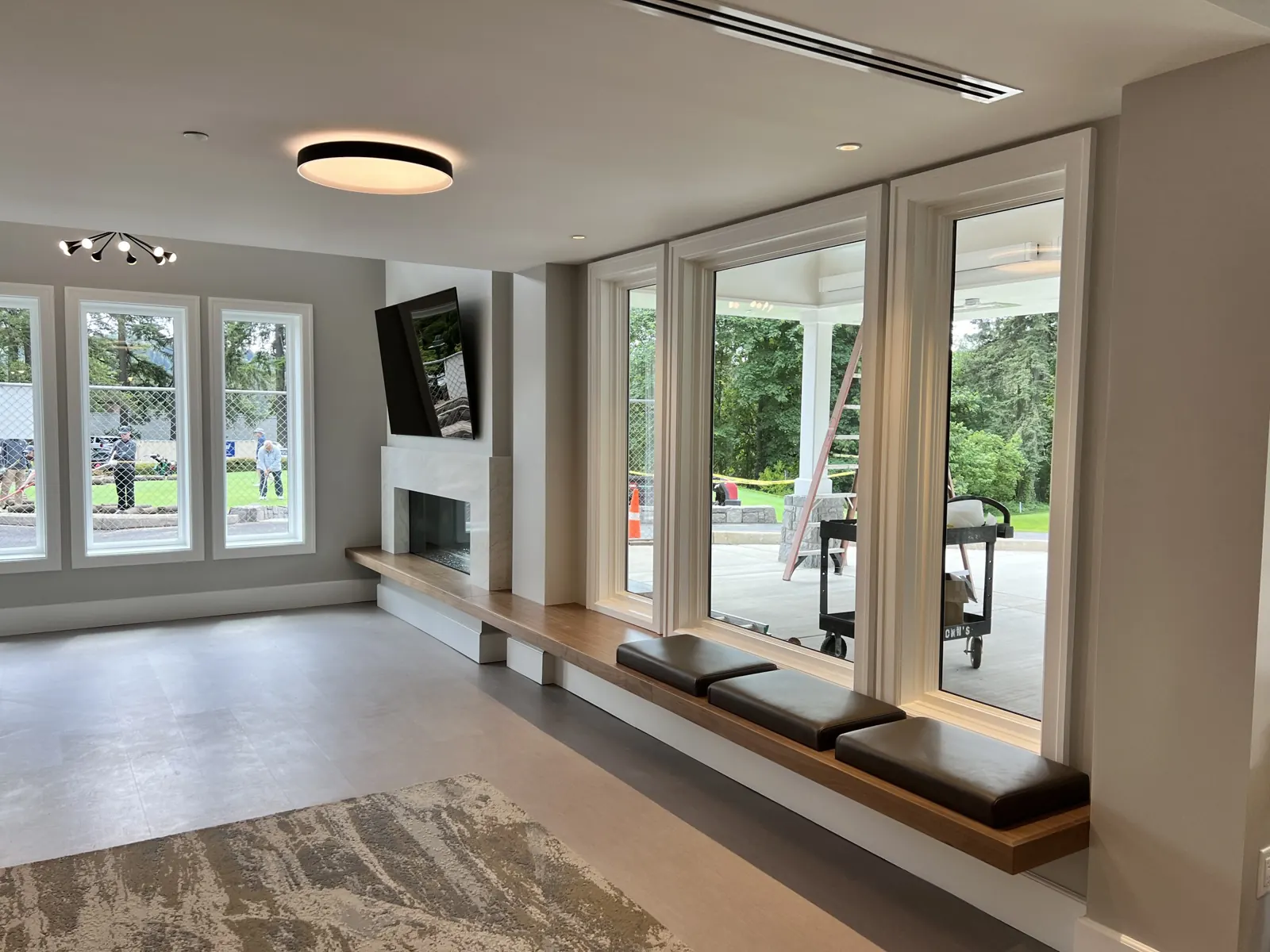 Built-in window seat under a row of windows