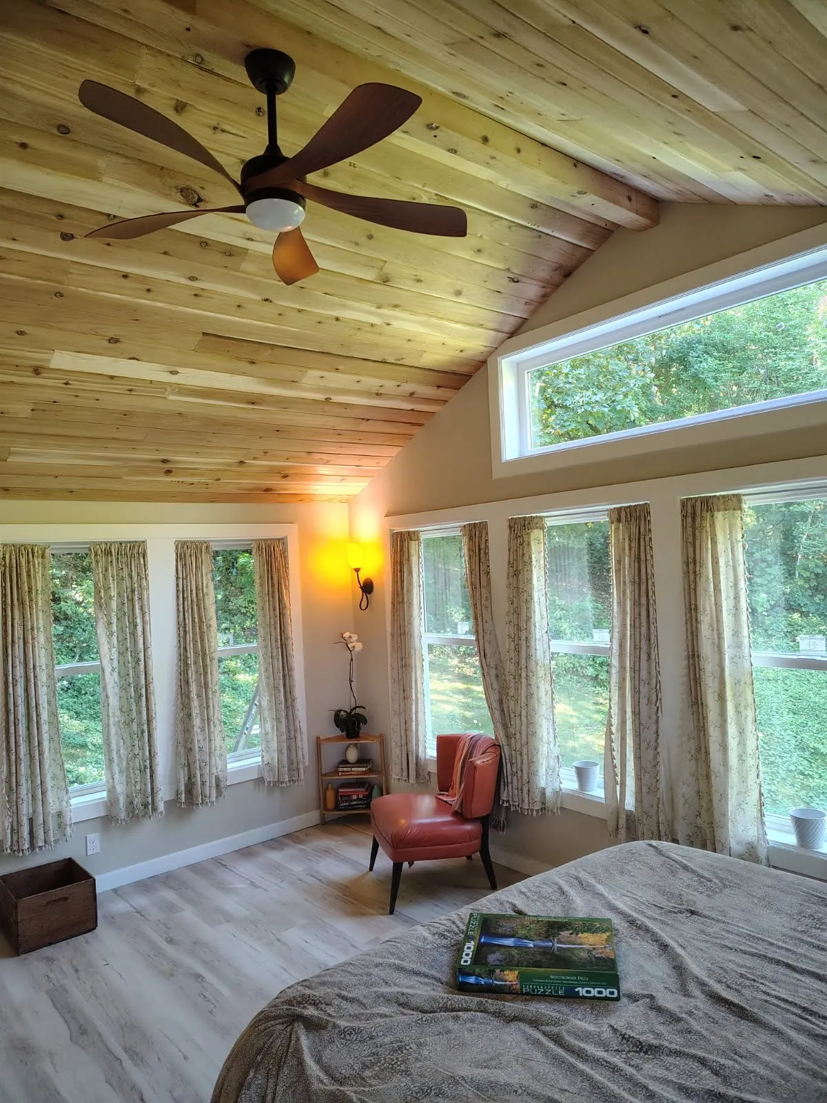 Bedroom with a cedar ceiling and window trim