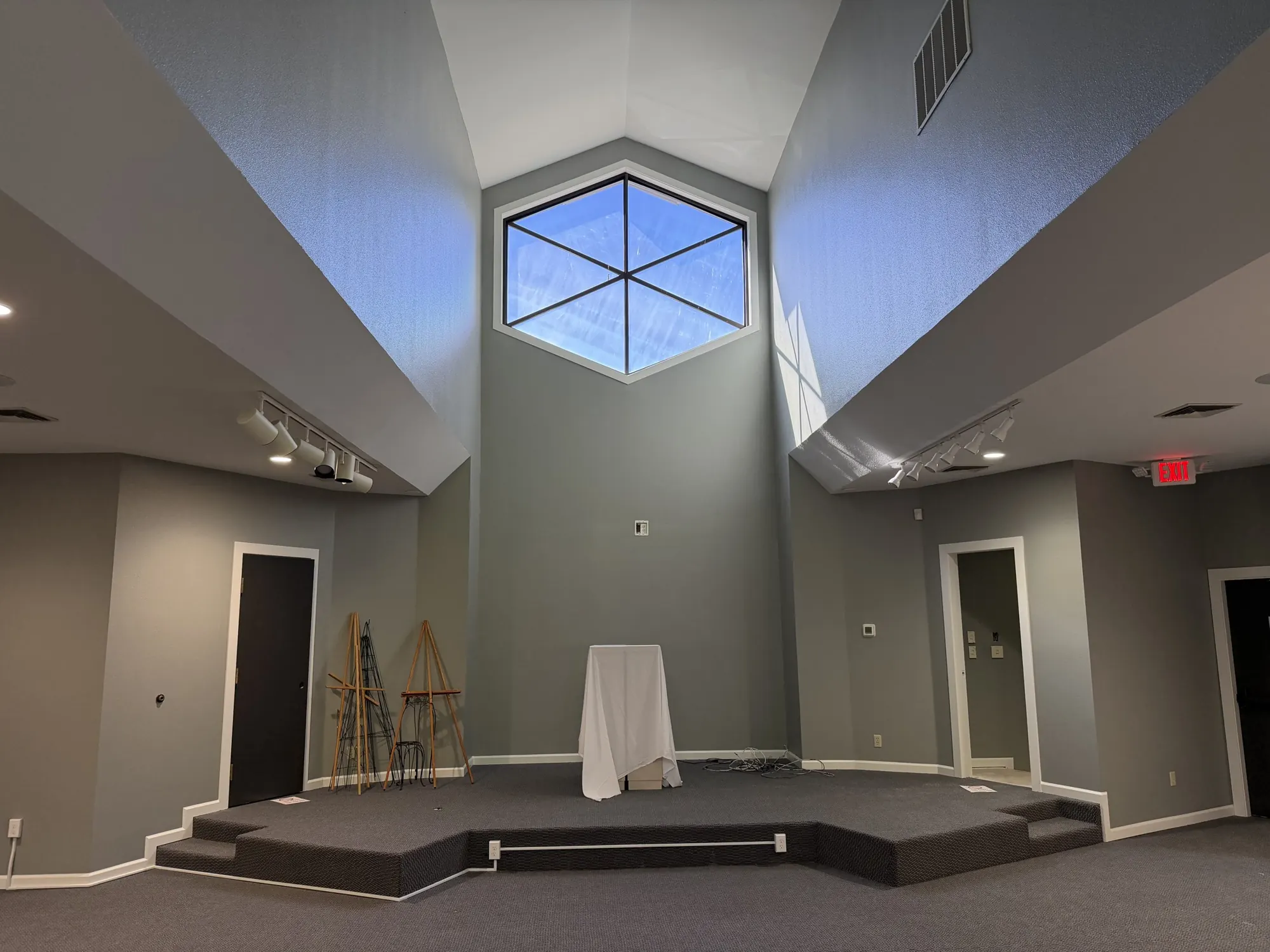 Chapel with a hexagonal window and trimmed doors