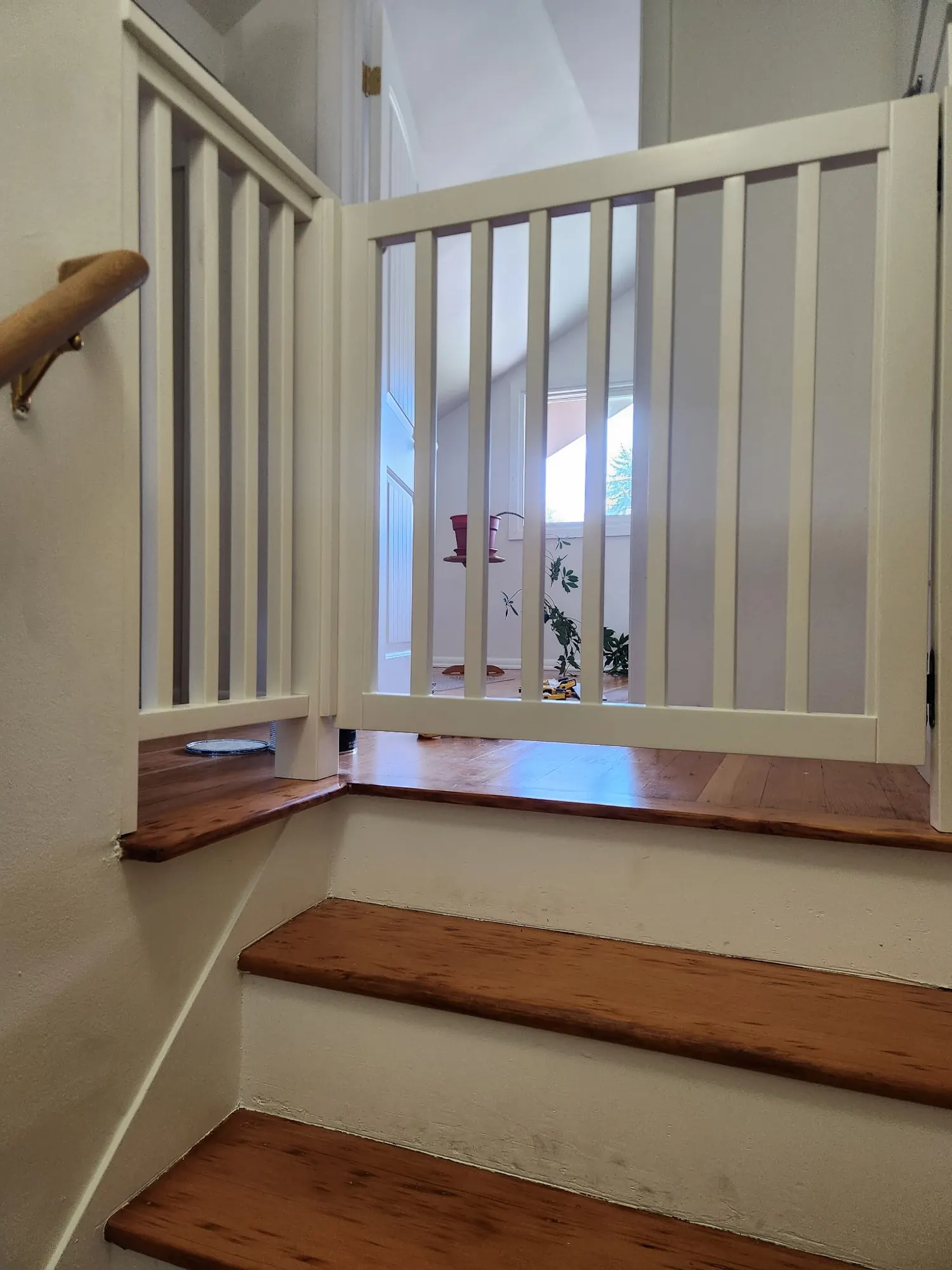 Painted stair rail and gate at a landing